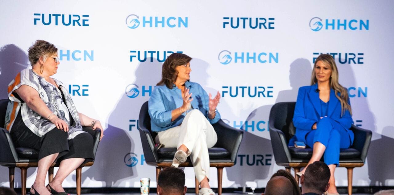 Healthcare professionals discussing at a panel event for future medical innovations.
