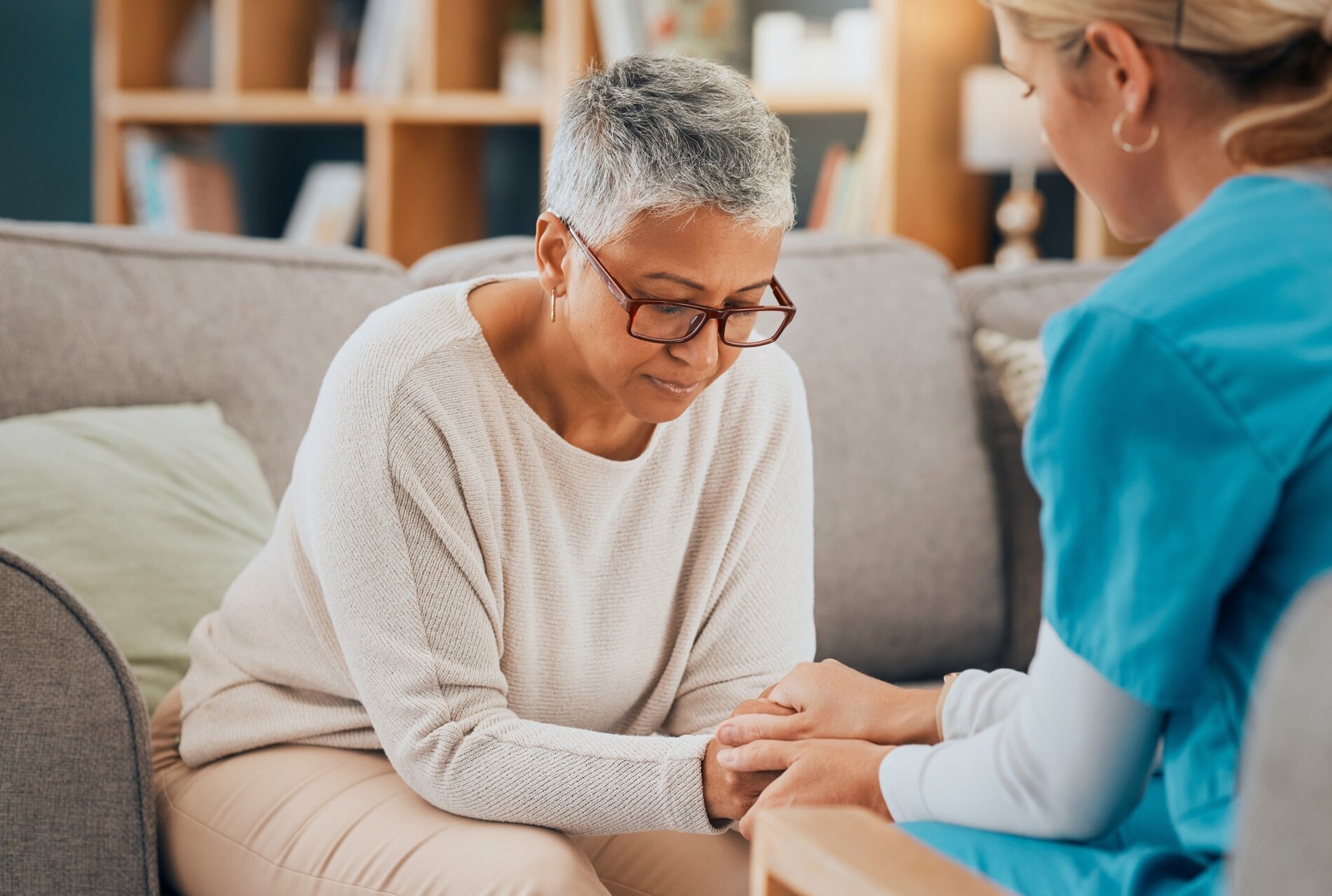 Caregiver supporting elderly person's mental health and emotional well-being.