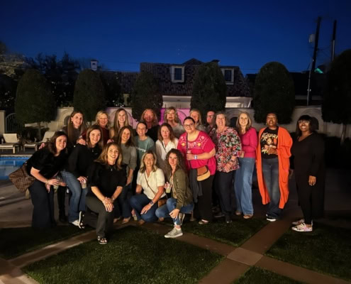 Group of caregivers and staff at VitalCaring during evening hours.