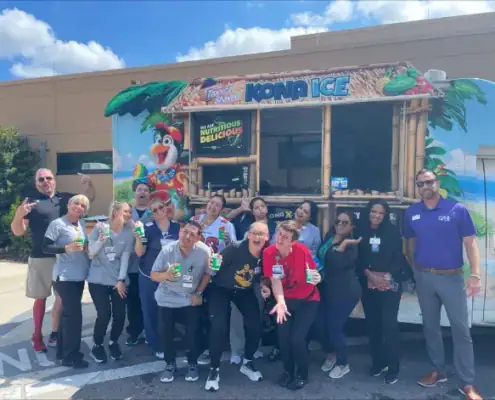 KONA ICE truck serving refreshing treats at VitalCaring event.