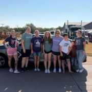 Group of people celebrating Labor Day outdoors in Elk City.